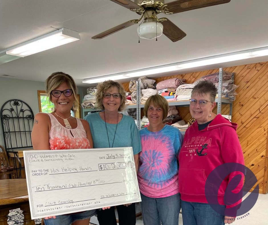 Accepting the check from the 100 Women Who Care founder and leader Stephanie Graham are, from left, Cindy Luther, Darla Schmittner and Nancy Sullivan.